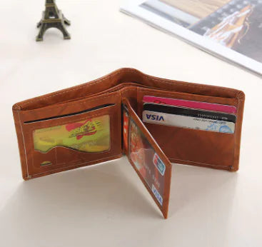 Brown leather wallet with multiple cards on a light surface