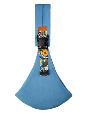 Blue dog bed with colorful fabric strap on a white background