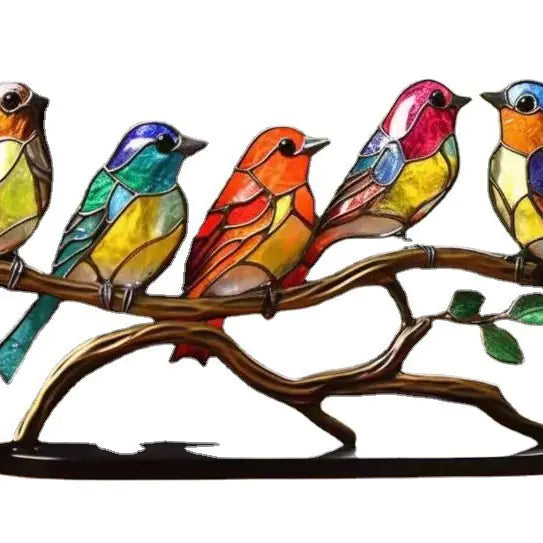 Colorful stained glass birds on a branch against a white background