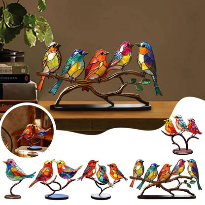 Colorful bird-shaped decorative lights on a branch with a warm background.