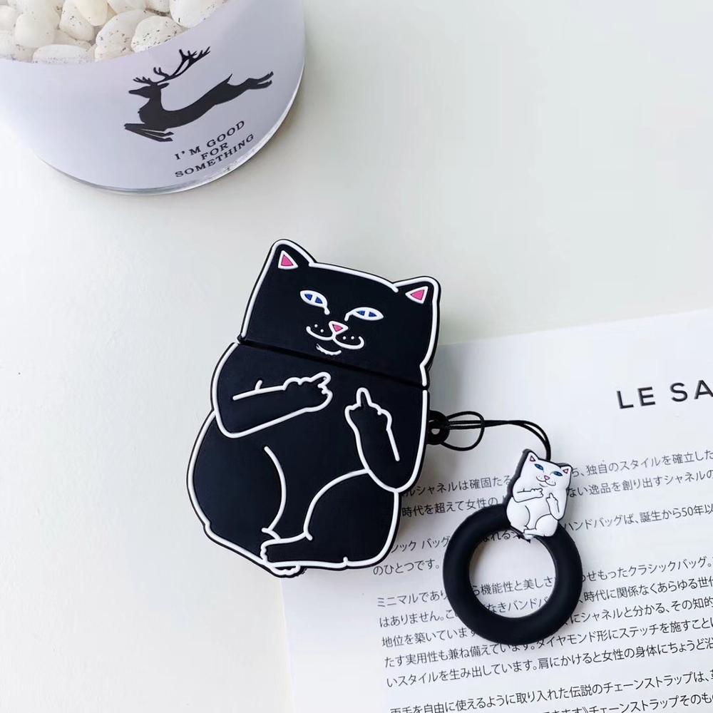 Black cat-shaped air pod case with a keychain on a white surface