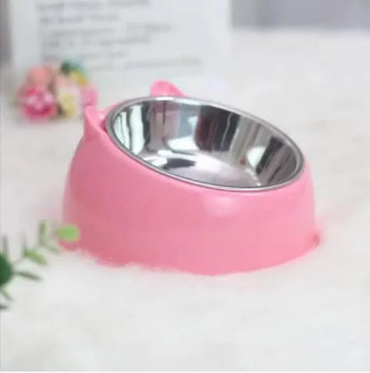 Pink pet bowl with a metal interior on a white background