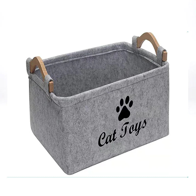 Gray storage bin with wooden handles and 'Cat Toys' text on a white background