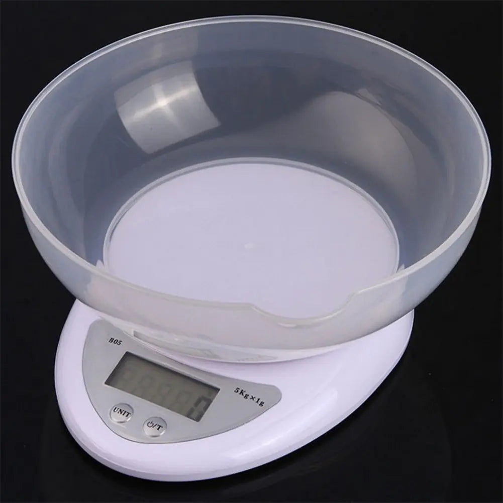 Digital kitchen scale with a clear bowl on a black background
