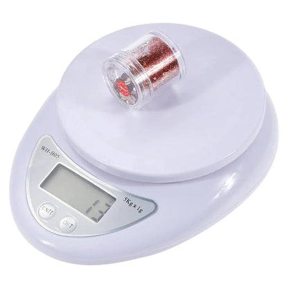 Digital kitchen scale with a clear container on a white background