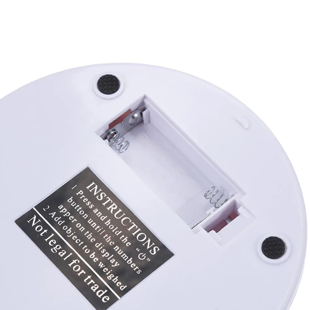 Close-up of a white electronic device with a label on a white background