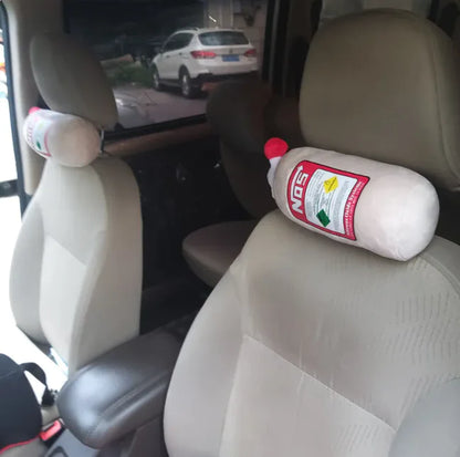 Car interior with a bottle-shaped pillow on the driver's seat