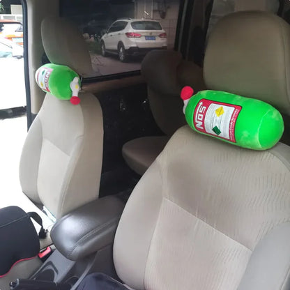 Two green bottles with red caps attached to car seat headrests.