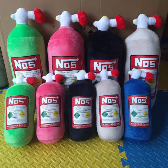 Set of colorful NOS bottle plush toys on a textured surface