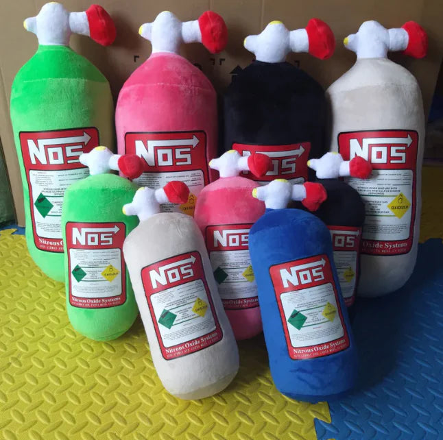 Collection of colorful NOS bottle plush toys on a textured surface
