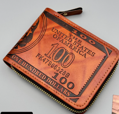 Brown wallet designed to resemble a $100 bill on a gray background