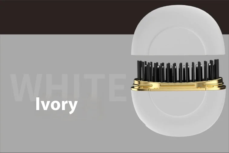 Hairbrush with black bristles and gold accents on a gray background, labeled 'Ivory'.