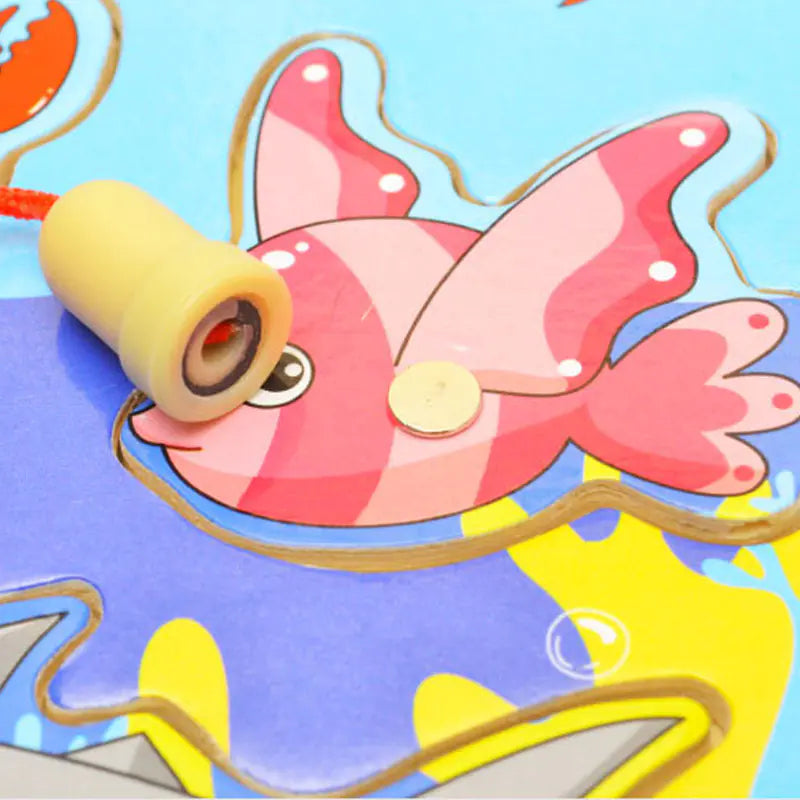 Colorful toy fish with a rope on a blue background