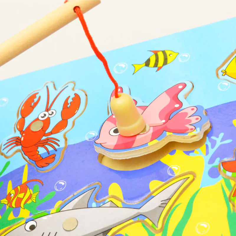 Colorful fishing game with wooden fish and lobster on a blue background